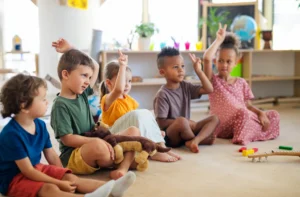 group-of-small-nursery-school-children-sitting-on